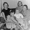 Andrei Krasko as a kid (in the middle, his mother is on the left)